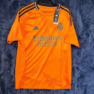 Real Madrid Orange Jersey with Black Accents